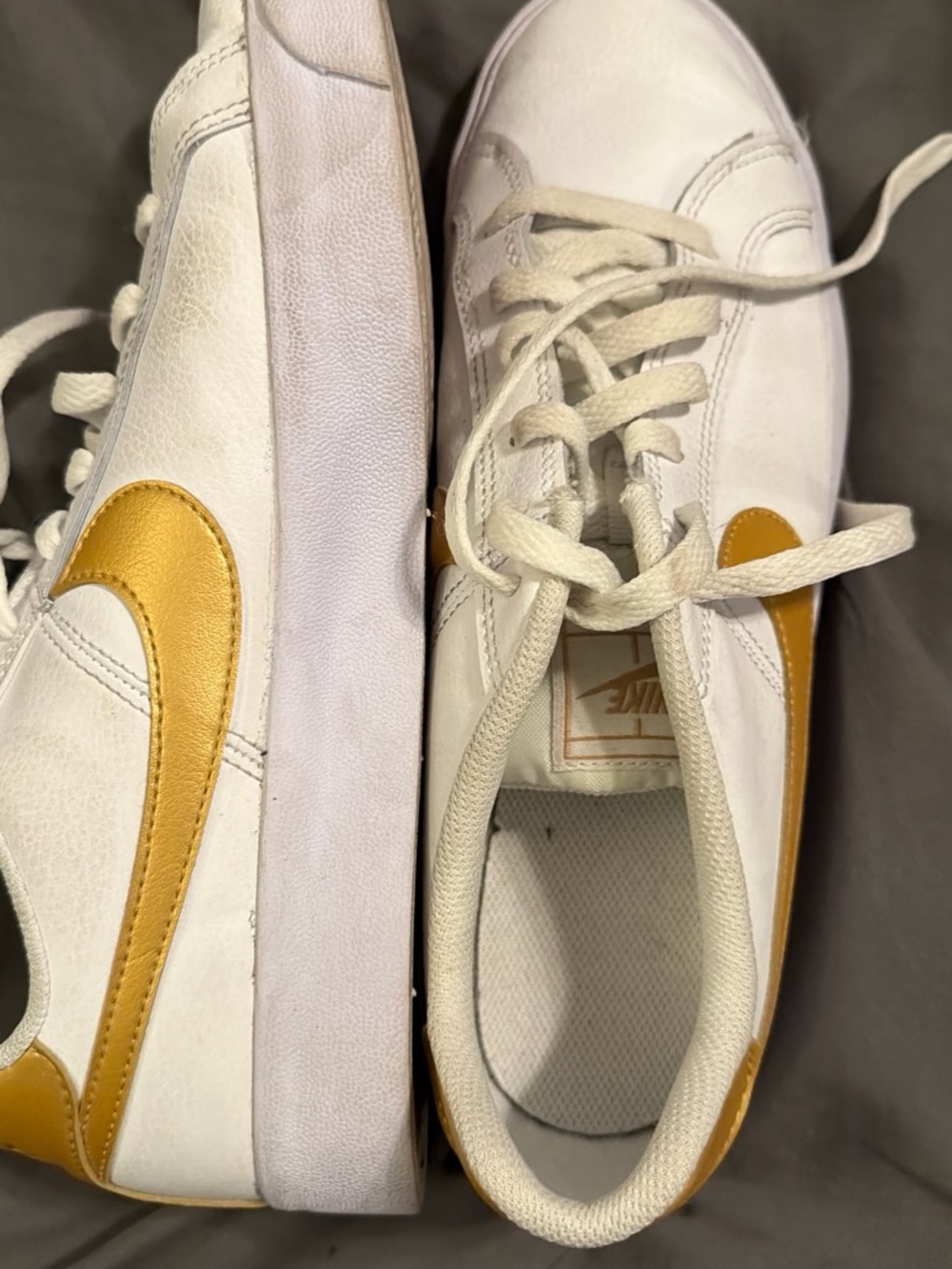 Nike Women’s White Sneakers with Gold Swoosh